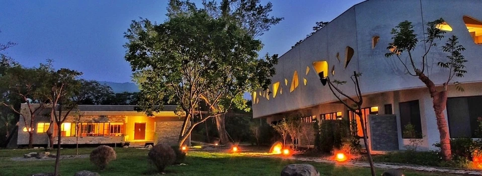 A panoramic evening view of the illuminated Yoga Wellness Center
